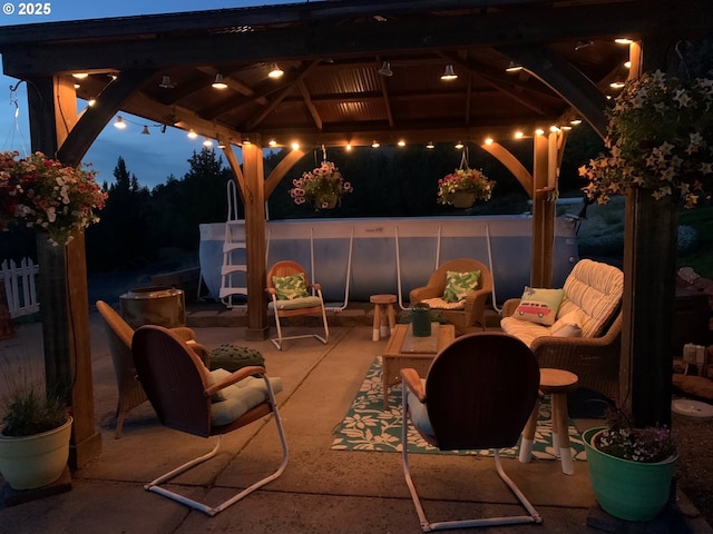 view of patio featuring an outdoor living space and a gazebo