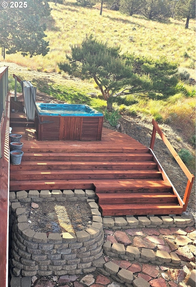 wooden deck featuring a hot tub