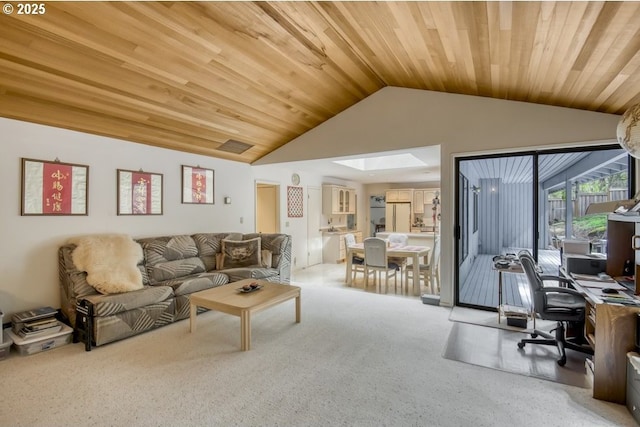 living area featuring light colored carpet, vaulted ceiling, wood ceiling, an office area, and a skylight