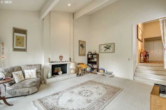 living room with carpet flooring, beam ceiling, a brick fireplace, stairway, and high vaulted ceiling