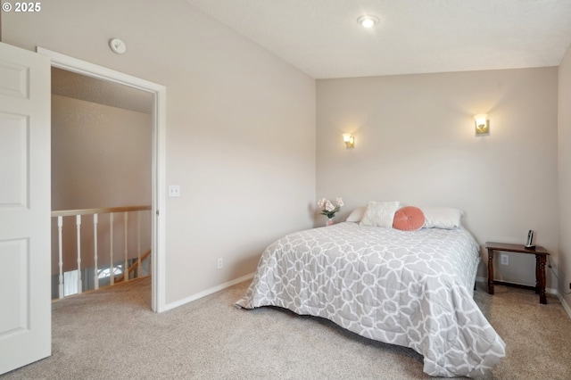 bedroom with carpet floors and baseboards