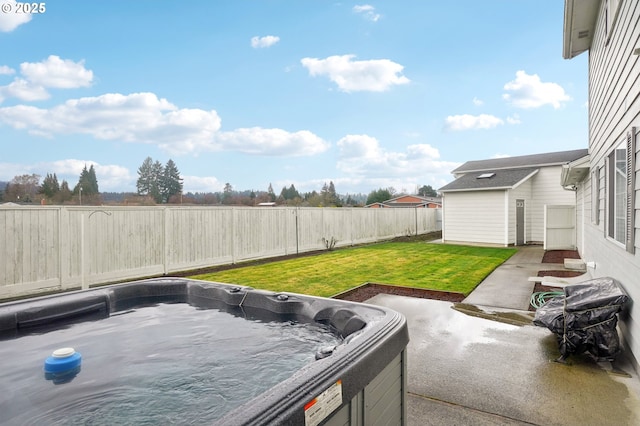 view of yard featuring a patio, a fenced backyard, and a hot tub