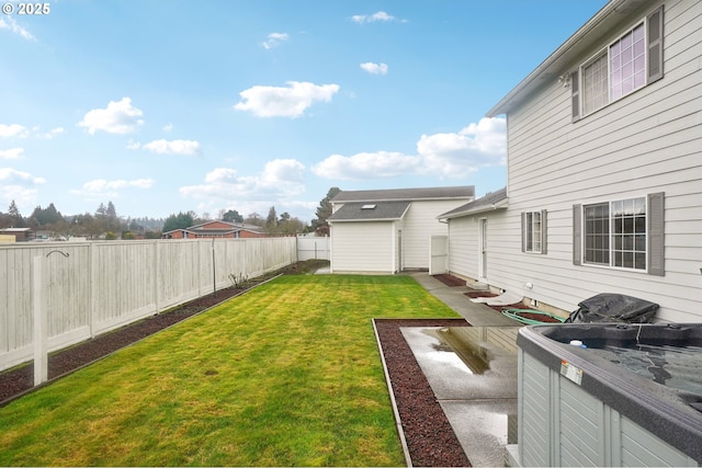 view of yard with a fenced backyard and an outdoor structure