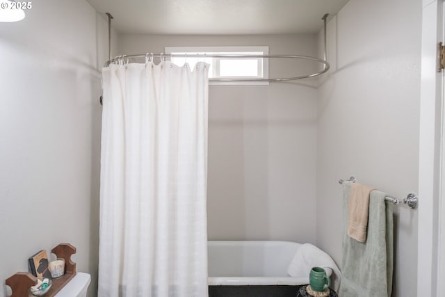 bathroom featuring shower / bathtub combination with curtain