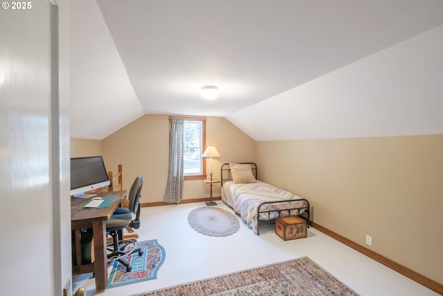 bedroom with lofted ceiling