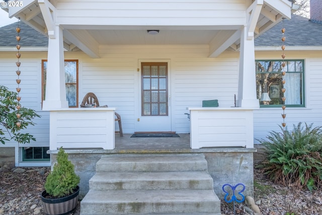 doorway to property featuring covered porch