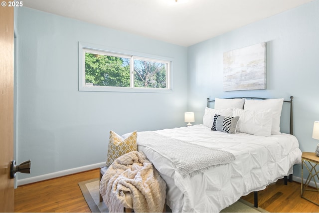 1422 NE 57th Ave, Portland, OR 97213 - bedroom featuring wood finished floors and baseboards