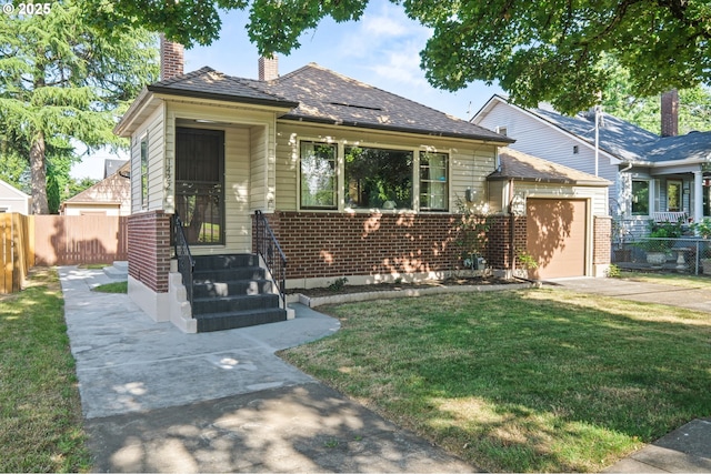 1422 NE 57th Ave, Portland, OR 97213 - view of front of house with a chimney, concrete driveway, an attached garage, and brick siding