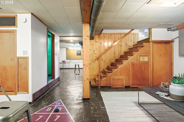 1422 NE 57th Ave, Portland, OR 97213 - basement with stairs, wood walls, and tile patterned floors