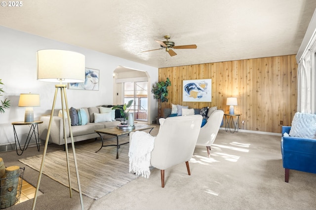 1422 NE 57th Ave, Portland, OR 97213 - living room featuring arched walkways, ceiling fan, and wooden walls