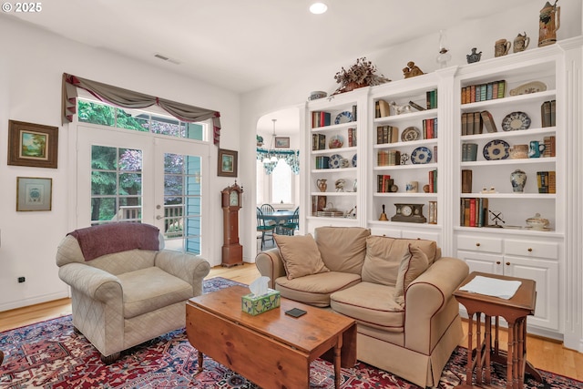 83485 Clear Lake Rd, Florence, OR 97439 - living area with light wood-style floors, french doors, arched walkways, and recessed lighting