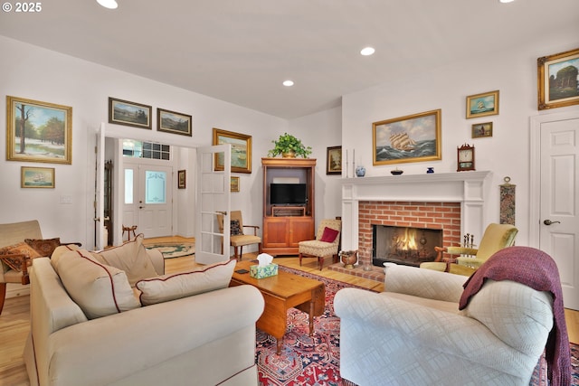 83485 Clear Lake Rd, Florence, OR 97439 - living room featuring light wood-type flooring, recessed lighting, and a fireplace
