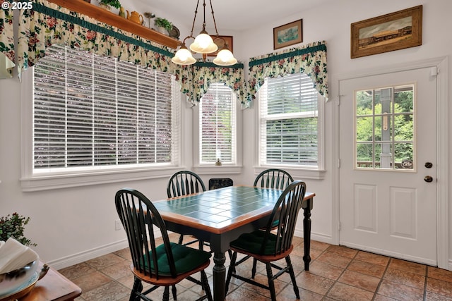 83485 Clear Lake Rd, Florence, OR 97439 - dining room with a chandelier and stone tile floors