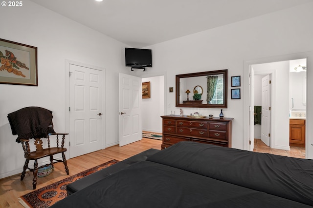 83485 Clear Lake Rd, Florence, OR 97439 - bedroom featuring light wood finished floors and ensuite bath