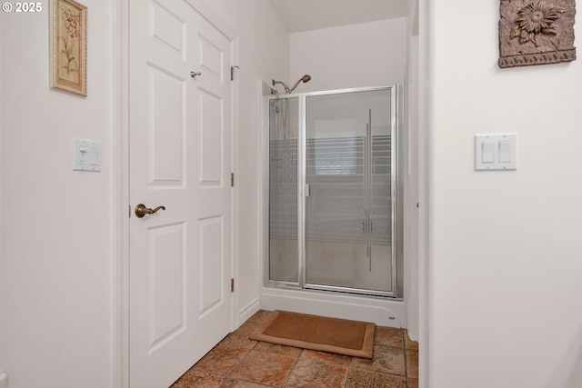 83485 Clear Lake Rd, Florence, OR 97439 - bathroom with a shower stall and stone finish floors