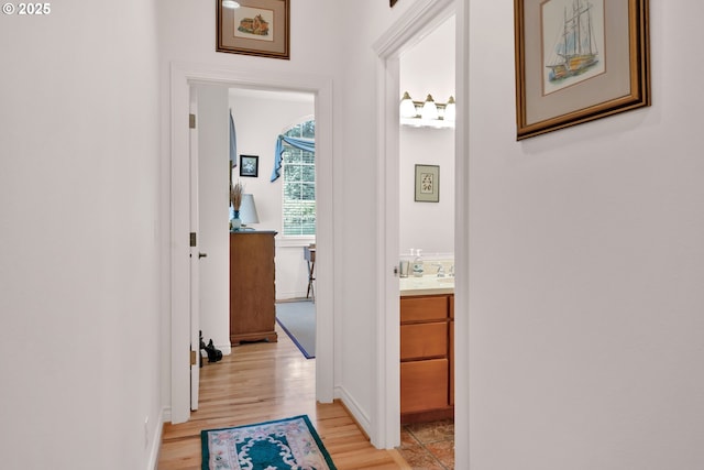 83485 Clear Lake Rd, Florence, OR 97439 - hallway featuring light wood finished floors and baseboards