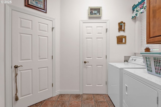 83485 Clear Lake Rd, Florence, OR 97439 - laundry area with cabinet space, washer and clothes dryer, and light stone finish floors
