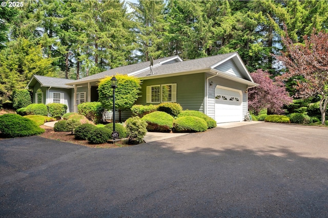 83485 Clear Lake Rd, Florence, OR 97439 - single story home featuring asphalt driveway, a garage, and roof with shingles