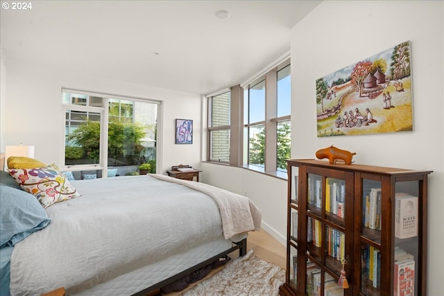 bedroom with hardwood / wood-style flooring