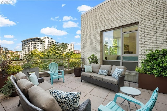 view of patio featuring a balcony and an outdoor hangout area