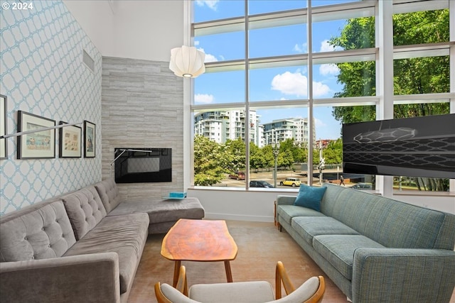 living room with a tile fireplace