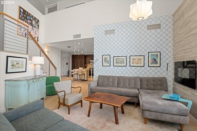 living room with a towering ceiling