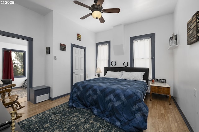 bedroom featuring hardwood / wood-style floors and ceiling fan