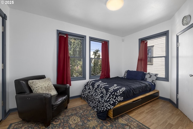 bedroom featuring dark hardwood / wood-style flooring