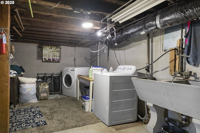 laundry area with washing machine and clothes dryer