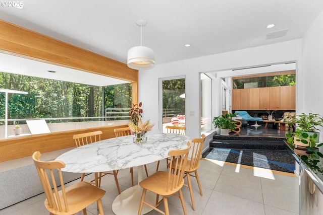 sunroom / solarium featuring beam ceiling