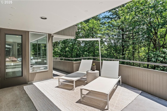 view of patio featuring a balcony