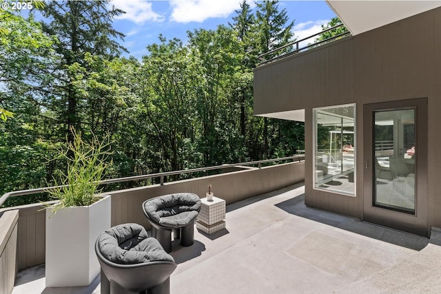 view of patio featuring a balcony