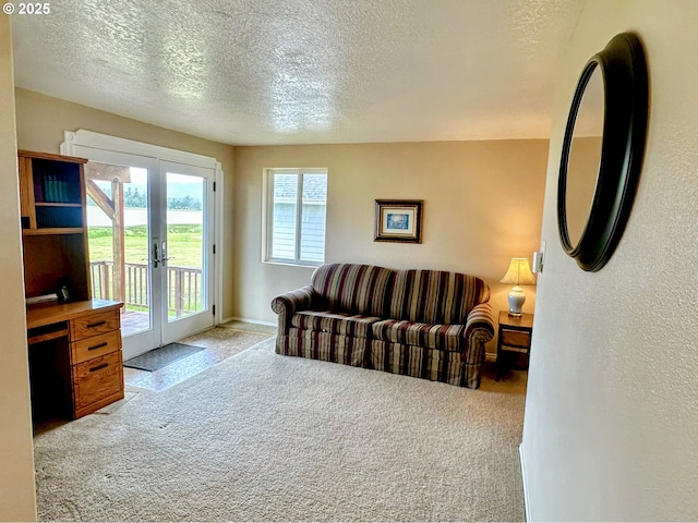 26230 Sandlake Rd, Cloverdale, OR 97112 - living room with carpet, french doors, and a textured ceiling