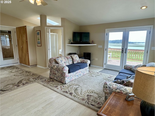 26230 Sandlake Rd, Cloverdale, OR 97112 - living area with french doors, a ceiling fan, lofted ceiling, baseboards, and wood finished floors