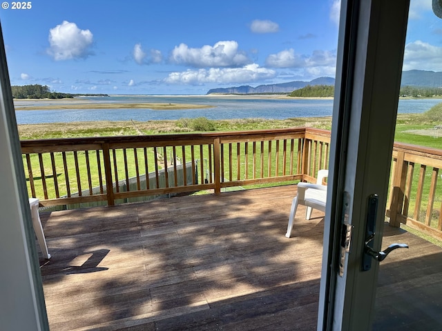 26230 Sandlake Rd, Cloverdale, OR 97112 - wooden terrace with a water and mountain view