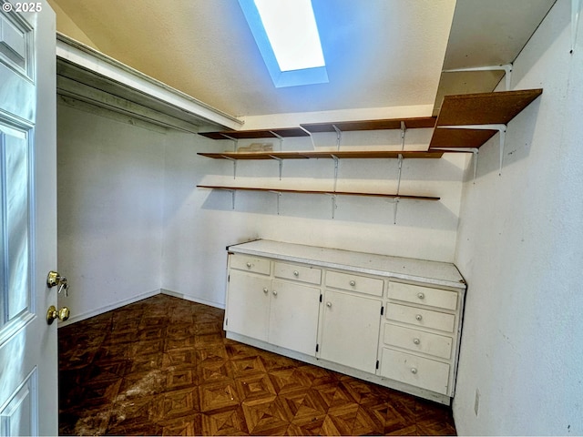26230 Sandlake Rd, Cloverdale, OR 97112 - spacious closet with a skylight and dark flooring