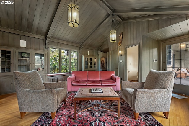 6633 SE 29th Ave, Portland, OR 97202 - living area featuring lofted ceiling with beams, wood walls, and wood finished floors