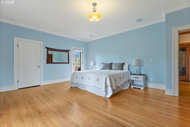 6633 SE 29th Ave, Portland, OR 97202 - bedroom with light wood-style flooring, baseboards, access to outside, and ornamental molding