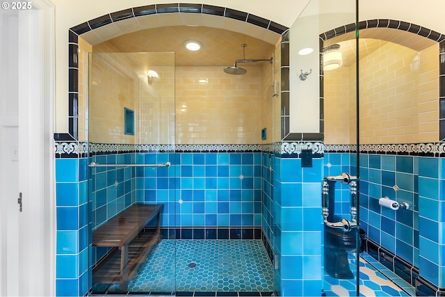 6633 SE 29th Ave, Portland, OR 97202 - bathroom with tile walls, tile patterned floors, recessed lighting, and a stall shower