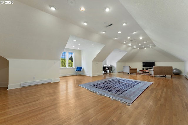 6633 SE 29th Ave, Portland, OR 97202 - bonus room with a baseboard radiator, light wood finished floors, baseboards, lofted ceiling, and visible vents