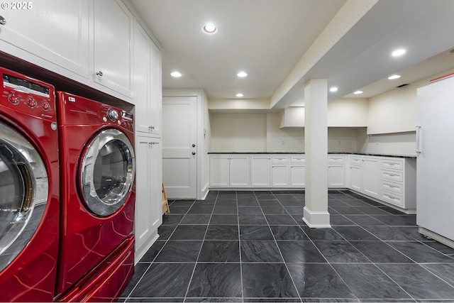 6633 SE 29th Ave, Portland, OR 97202 - washroom with baseboards, recessed lighting, dark tile patterned flooring, and independent washer and dryer