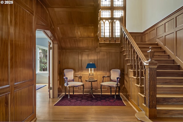 6633 SE 29th Ave, Portland, OR 97202 - living area featuring stairway, wooden ceiling, a decorative wall, and wood finished floors