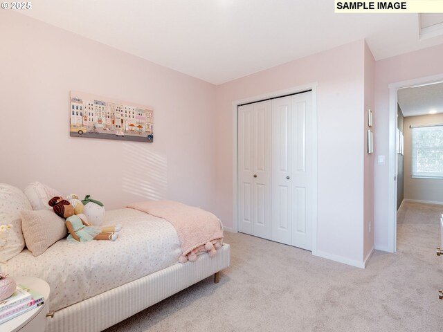 walk in closet featuring light carpet