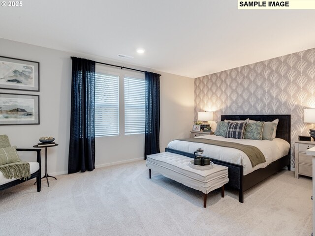 bedroom featuring light carpet