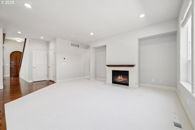 13733 NW Trevino St, Portland, OR 97229 - unfurnished living room featuring a premium fireplace, recessed lighting, and baseboards