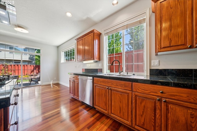 13733 NW Trevino St, Portland, OR 97229 - kitchen with dishwasher, a sink, dark wood finished floors, baseboards, and brown cabinets