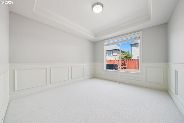 13733 NW Trevino St, Portland, OR 97229 - spare room featuring a raised ceiling, a decorative wall, carpet, and a wainscoted wall