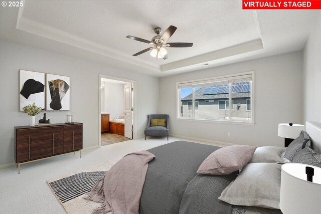 13733 NW Trevino St, Portland, OR 97229 - bedroom with a tray ceiling, carpet flooring, and ensuite bath