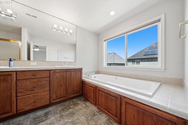 13733 NW Trevino St, Portland, OR 97229 - full bathroom featuring vanity, a garden tub, a shower with door, and a ceiling fan