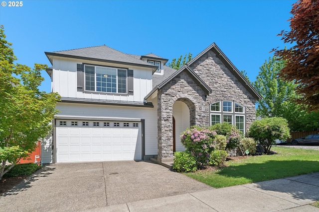 13733 NW Trevino St, Portland, OR 97229 - view of front of property with stone siding, board and batten siding, concrete driveway, an attached garage, and a front yard